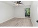 Light and airy bedroom with natural light, wood-look floors and a window at 3568 Wilkinson Woods Dr # 23, Sarasota, FL 34231