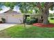 Charming single-story home with mature landscaping and a well-manicured lawn at 3568 Wilkinson Woods Dr # 23, Sarasota, FL 34231
