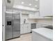 Well-equipped kitchen featuring stainless steel appliances and white cabinetry at 3568 Wilkinson Woods Dr # 23, Sarasota, FL 34231