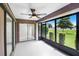 Enclosed lanai with sliding doors, a ceiling fan, and views of the backyard at 3568 Wilkinson Woods Dr # 23, Sarasota, FL 34231