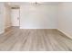 Bright living room with light gray flooring, a ceiling fan and fresh white walls at 3568 Wilkinson Woods Dr # 23, Sarasota, FL 34231