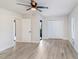 Spacious main bedroom with closet, ceiling fan, and light gray flooring at 3568 Wilkinson Woods Dr # 23, Sarasota, FL 34231