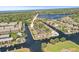 An aerial shot highlights waterfront homes with easy access to canals, boats, and lush green surroundings at 358 Moorings Cove Dr # 4B, Tarpon Springs, FL 34689