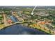 Aerial of waterfront homes surrounded by lush greenery; perfect for a serene community at 358 Moorings Cove Dr # 4B, Tarpon Springs, FL 34689
