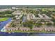 An aerial shot of waterfront homes with community canals and landscaping at 358 Moorings Cove Dr # 4B, Tarpon Springs, FL 34689