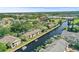 Aerial view of waterfront condos, canal system, and boat docks at 358 Moorings Cove Dr # 4B, Tarpon Springs, FL 34689