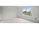 Unstaged room with a view of a canal and a boat parked on the other side at 358 Moorings Cove Dr # 4B, Tarpon Springs, FL 34689