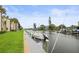Dock view featuring a boat and scenic waterfront landscape at 358 Moorings Cove Dr # 4B, Tarpon Springs, FL 34689