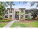 Well-maintained two-story condo building with tidy landscaping and convenient access to the entrance at 358 Moorings Cove Dr # 4B, Tarpon Springs, FL 34689