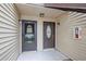 The building features two front doors, each leading to separate units, enhancing privacy and accessibility at 358 Moorings Cove Dr # 4B, Tarpon Springs, FL 34689