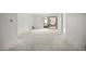 Open living space with sliding glass doors that lead to outdoor space at 358 Moorings Cove Dr # 4B, Tarpon Springs, FL 34689
