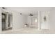 Unfinished living room with fresh paint and new lighting fixtures that features an ornate front door at 358 Moorings Cove Dr # 4B, Tarpon Springs, FL 34689
