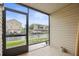Screened-in patio providing views of a waterway and nearby docks at 358 Moorings Cove Dr # 4B, Tarpon Springs, FL 34689