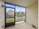Screened-in patio with a view of the marina and community waterway at 358 Moorings Cove Dr # 4B, Tarpon Springs, FL 34689