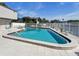 Community pool offers a relaxing escape with plenty of seating and tranquil waterfront views at 358 Moorings Cove Dr # 4B, Tarpon Springs, FL 34689