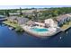 A waterfront community pool with lounge chairs offers a relaxing and scenic amenity at 358 Moorings Cove Dr # 4B, Tarpon Springs, FL 34689