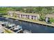Waterfront condo building with boat docks, scenic views, and tranquil setting at 358 Moorings Cove Dr # 4B, Tarpon Springs, FL 34689