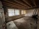 Unfinished basement with exposed ceiling beams and cinder block walls at 4050 Iris N St, St Petersburg, FL 33703