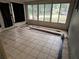 Sunroom features tile flooring and walls of windows at 4050 Iris N St, St Petersburg, FL 33703