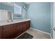 Bathroom features a spacious vanity with granite countertop, single sink, and a large mirror at 5955 Caldera Ridge Dr, Lithia, FL 33547