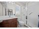 Bright bathroom features a vanity with solid surface countertops and a glass enclosed tiled shower stall at 5955 Caldera Ridge Dr, Lithia, FL 33547