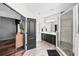 Well-lit bathroom featuring an enclosed shower and single sink vanity at 5955 Caldera Ridge Dr, Lithia, FL 33547