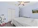 Comfortable bedroom with ceiling fan and media, perfect for relaxing at 5955 Caldera Ridge Dr, Lithia, FL 33547