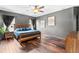 Bedroom featuring wood floors and ceiling fan at 5955 Caldera Ridge Dr, Lithia, FL 33547