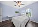 Cozy bedroom featuring a ceiling fan, TV, and abundant natural light at 5955 Caldera Ridge Dr, Lithia, FL 33547