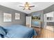 Relaxing primary bedroom features decorative wall art and ensuite access at 5955 Caldera Ridge Dr, Lithia, FL 33547