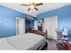Bright bedroom featuring hardwood floors, a closet and large windows for natural light at 5955 Caldera Ridge Dr, Lithia, FL 33547