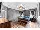 This spacious bedroom features stylish wood floors and a ceiling fan at 5955 Caldera Ridge Dr, Lithia, FL 33547