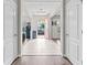 Bright foyer featuring tile flooring and a striking pink front door that enhances the curb appeal at 5955 Caldera Ridge Dr, Lithia, FL 33547