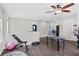 Upstairs bonus room with a foosball table and fitness equipment, perfect for recreation at 5955 Caldera Ridge Dr, Lithia, FL 33547