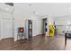 Spacious game room with arcade games, cabinets, and ample space for Gathering fun at 5955 Caldera Ridge Dr, Lithia, FL 33547