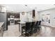 Modern kitchen featuring stainless steel appliances, granite countertops, and a convenient breakfast bar at 5955 Caldera Ridge Dr, Lithia, FL 33547