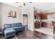 Cozy living room with hardwood floors and easy access to the kitchen with wooden cabinets at 5955 Caldera Ridge Dr, Lithia, FL 33547