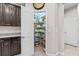 Walk-in pantry with shelving provides ample storage space, adjacent to the kitchen at 5955 Caldera Ridge Dr, Lithia, FL 33547