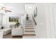 Bright staircase leads upstairs, blending natural light and neutral colors for a welcoming ambiance at 5955 Caldera Ridge Dr, Lithia, FL 33547