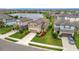 Aerial view of the homes and lake, highlighting the community and landscaping at 6555 Kenava Loop, Palmetto, FL 34221
