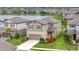 Aerial view of a lovely home with a manicured lawn and colorful landscaping near a peaceful lake at 6555 Kenava Loop, Palmetto, FL 34221