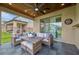 View of the covered lanai featuring comfortable seating and a patio door at 6555 Kenava Loop, Palmetto, FL 34221