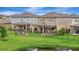 Well-maintained backyard with a covered patio, pergola, and fire pit area offering outdoor enjoyment at 6555 Kenava Loop, Palmetto, FL 34221