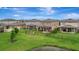 Large backyard with covered patio, pergola, and fire pit, perfect for outdoor living and entertaining at 6555 Kenava Loop, Palmetto, FL 34221