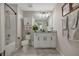 Bathroom boasts granite counters, storage, vanity and shower/bath combination at 6555 Kenava Loop, Palmetto, FL 34221