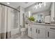 Bathroom with a shower/tub, cabinets, granite counters, and tile floors at 6555 Kenava Loop, Palmetto, FL 34221