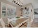 Bright dining area with a table, window shutters, and decorative wall art at 6555 Kenava Loop, Palmetto, FL 34221