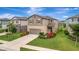 Well maintained two-story home, with inviting curb appeal, landscaping, and a driveway at 6555 Kenava Loop, Palmetto, FL 34221