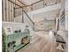 Inviting foyer with hardwood floors, staircase and an open view to the living room at 6555 Kenava Loop, Palmetto, FL 34221