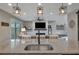 Open concept kitchen island with granite countertop and seamless flow into the living room at 6555 Kenava Loop, Palmetto, FL 34221